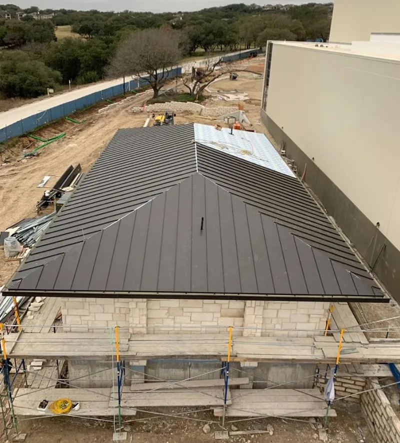 Metal roof new construction with scaffolding in Milton